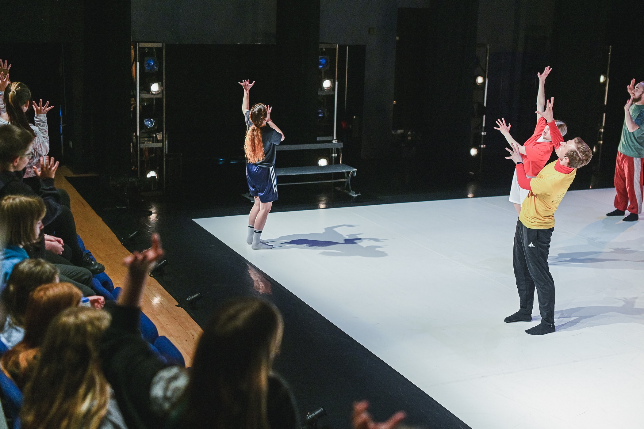 children dancing in their theatre seats