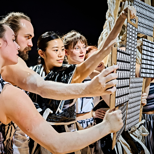 dancers looking at sketches