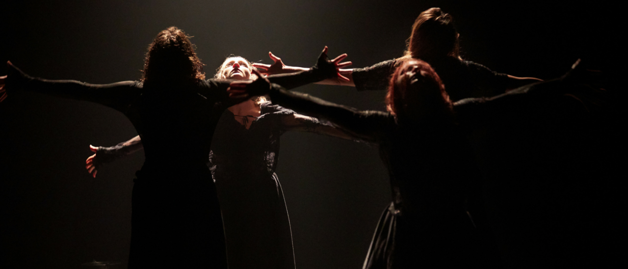 4 dancers with heads facing up