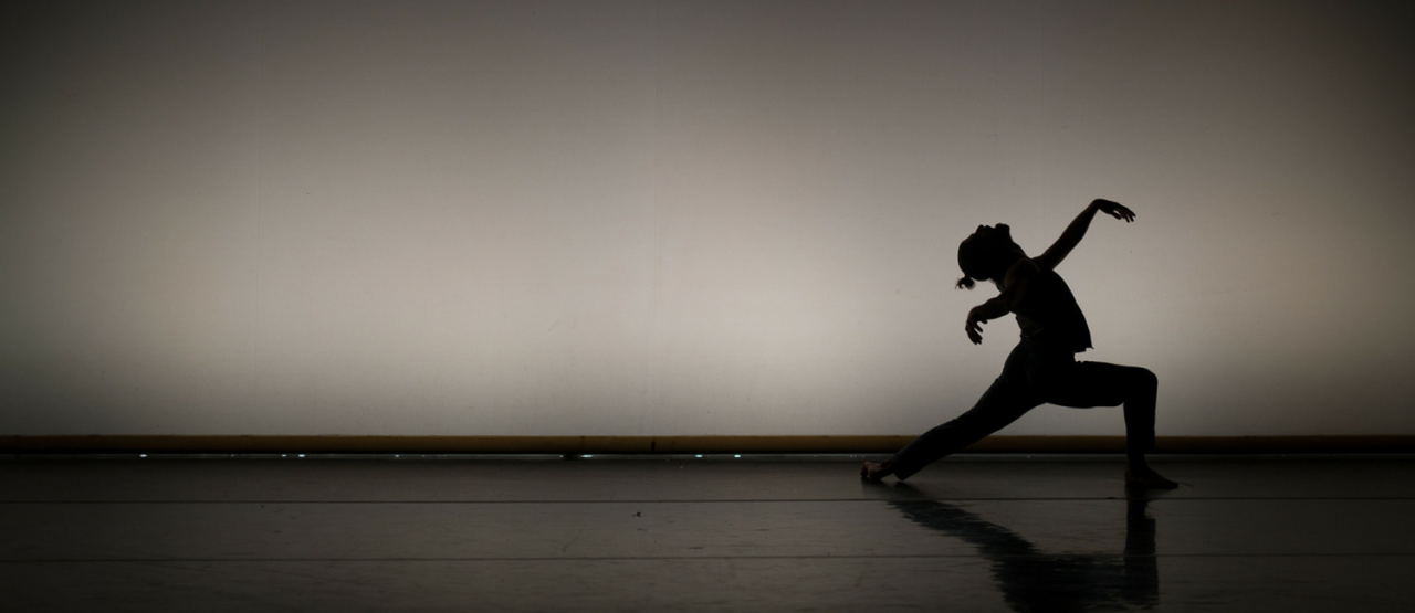 tuplet, dancer silhouetted against a white background