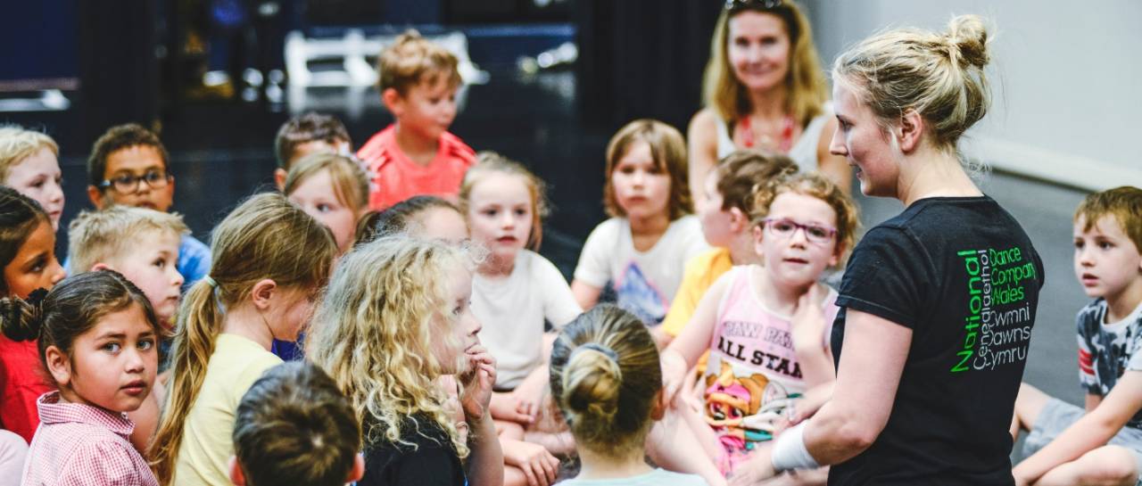 school workshop dance ambassador talking to a group