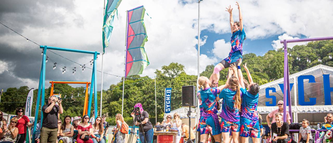 Dancers holding Elena in the air