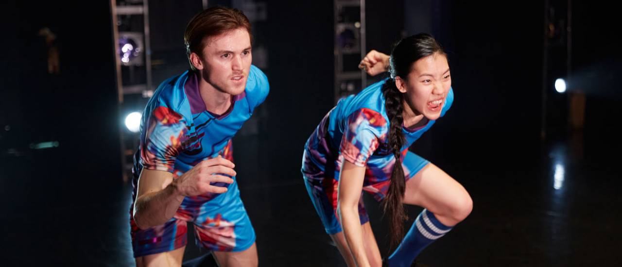 2 dancers moving forward in slow motion