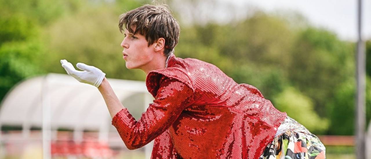 a dancer blowing a kiss to the crowd