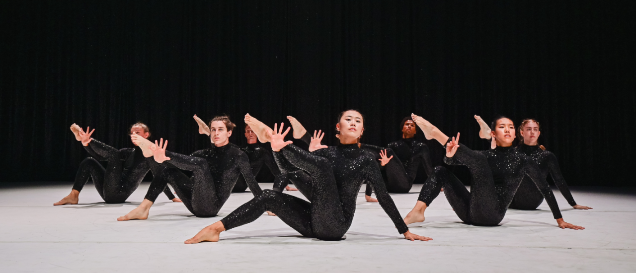 5 dancers in black long lace dresses