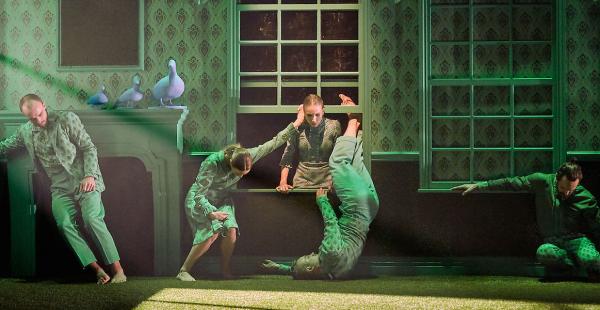 The Green House, dancers positioned around the window of a room.